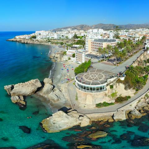 Admire the coastal vistas from the Balcón de Europa, a seven-minute drive away