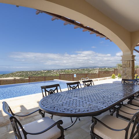 Dine altogether on the covered poolside terrace against a captivating Cypriot backdrop
