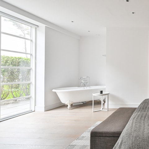 Indulge in a long soak in the master bedroom's in-room bathtub