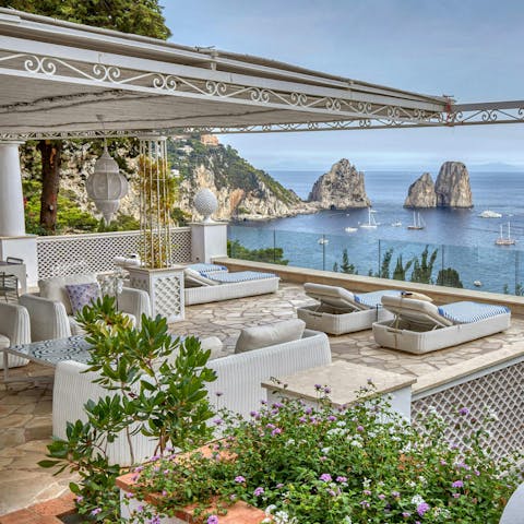 Admire the views of the Faraglioni Rocks from the terrace