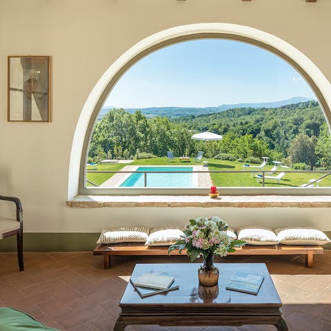 Look out over the hills from the arched window
