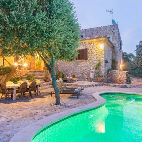 The villa is located in a quiet area, surrounded by beautiful gardens.