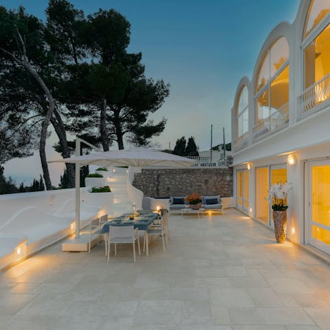 Enjoy an alfresco sunset dinner prepared for you and your guests by the villa's private chef