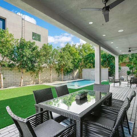 Tuck into meat seared to perfection on the barbecue out on the home's covered terrace