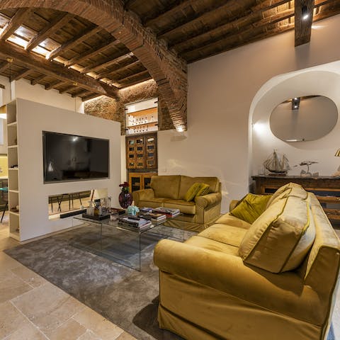 Gather together for a movie night on the living room's big screen, a glass of Italian wine in hand