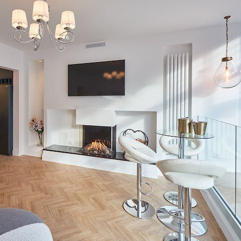 Get cosy and warm on a chilly evening by the fireplace