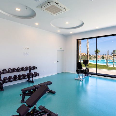 Stay on top of your fitness goals with a workout in the communal gym