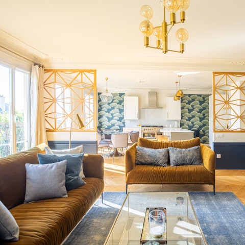 Admire the chic decor in the light-filled living area