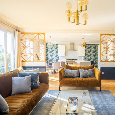 Admire the chic decor in the light-filled living area