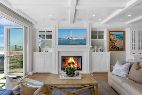 Warm up by the fire as the ocean light shifts outside