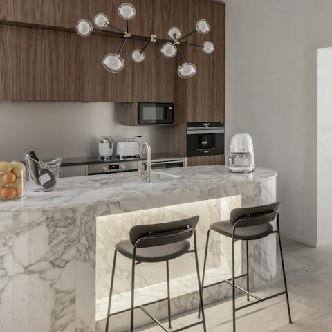 Enjoy your morning coffee while mingling at the kitchen bar