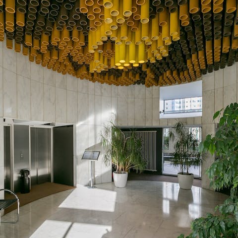 Admire the modernist styling in the building's impressive lobby