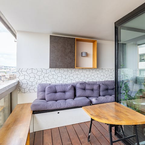 Get some fresh air on the home's balcony