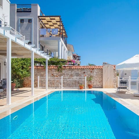 Splash around with the kids in the private swimming pool