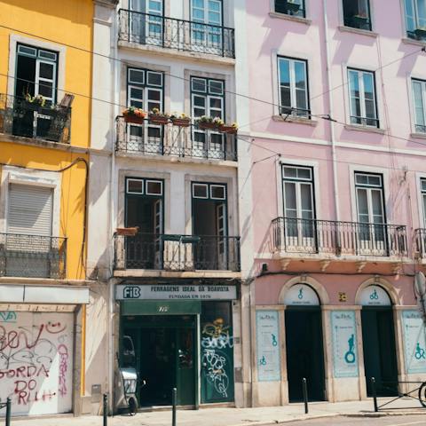 Explore your atmospheric Bairro Alto neighbourhood and soak up views of the city from the Miradouro São Pedro de Alcântara viewpoint