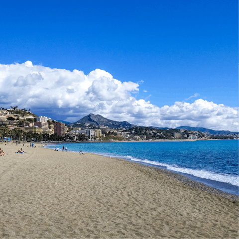Take a stroll to the nearby beach and work on your tan