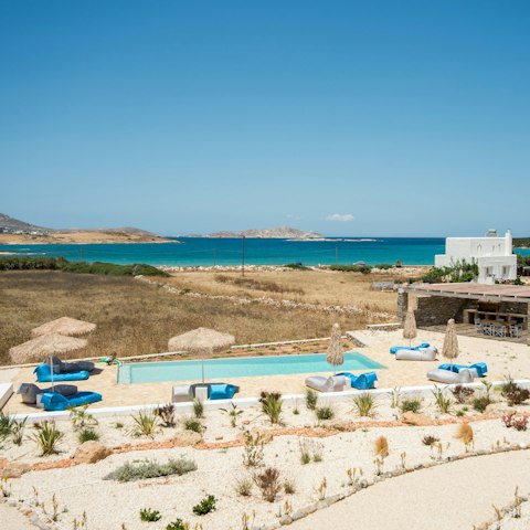 Gaze out over the shared pool and the glistening Aegean Sea beyond