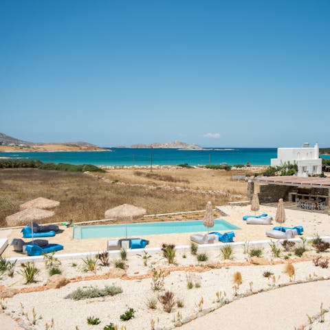 Gaze out over the shared pool and the glistening Aegean Sea beyond