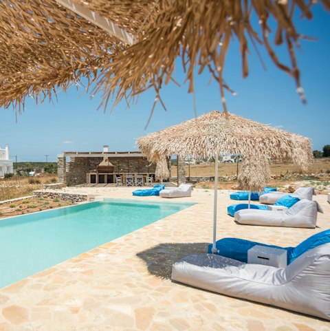 Relax by the gorgeous infinity pool with a good book
