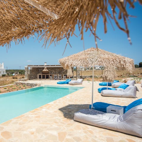 Relax by the gorgeous infinity pool with a good book