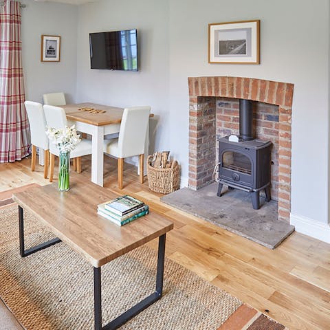 Get cosy around the wood-burning fire on chilly winter evenings – all that's missing is a cup of hot chocolate and a well-thumbed book
