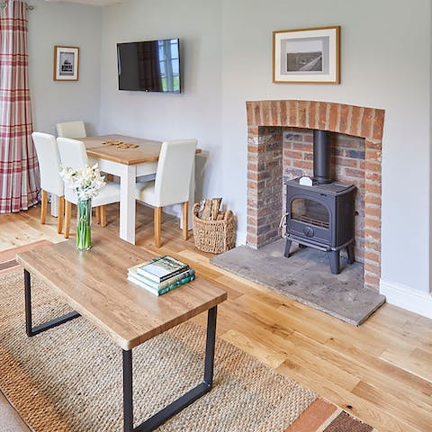 Get cosy around the wood-burning fire on chilly winter evenings – all that's missing is a cup of hot chocolate and a well-thumbed book