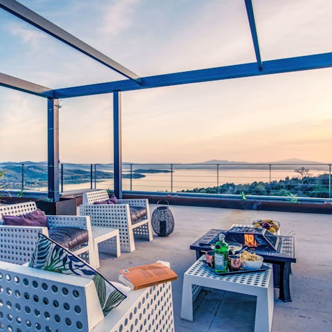 Toast the day’s end beside the terrace firepit