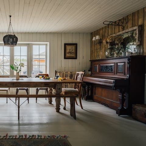 Play a tune on the piano as your group gathers for a sit-down meal