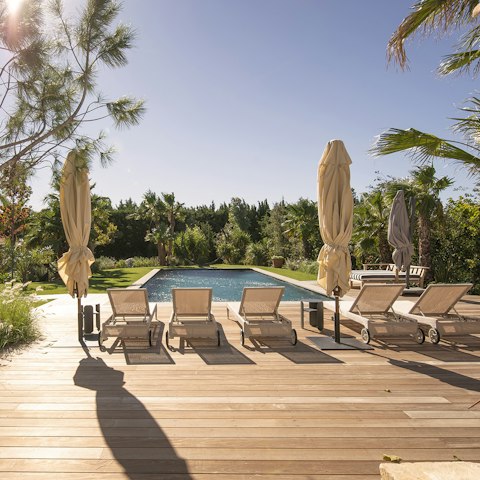 Soak up the sun beside the heated salt-water pool