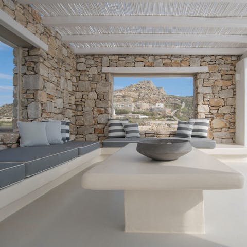 Relax on the covered terrace with a glass of Greek wine in hand at sundown