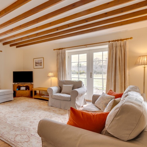 Cosy up together in front of the fire with a glass of wine