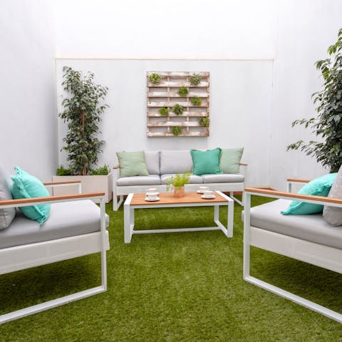 Enjoy a late afternoon cocktail on your private terrace, relaxing on the soft outdoor sofas