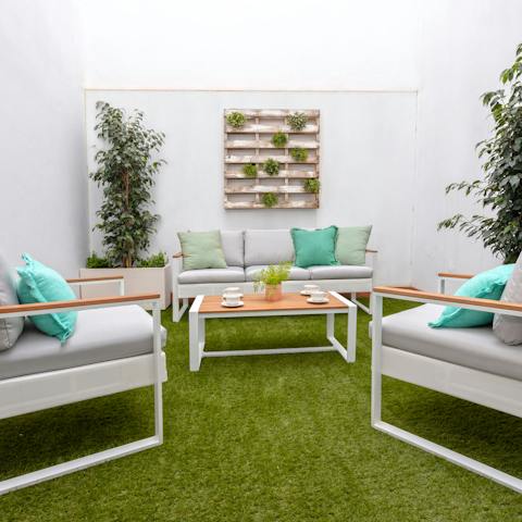 Enjoy a late afternoon cocktail on your private terrace, relaxing on the soft outdoor sofas