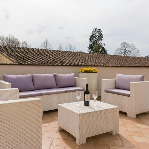 Unwind with a glass of wine on the pretty terrace