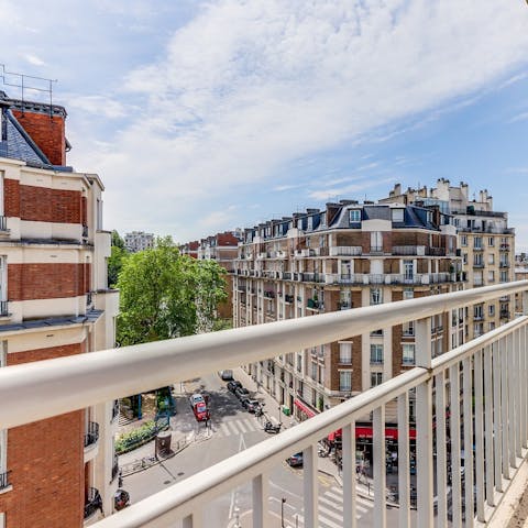 Pad out to the balcony and watch the hustle and bustle below