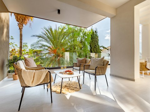 Sip wine among palms on the sun-caught terrace