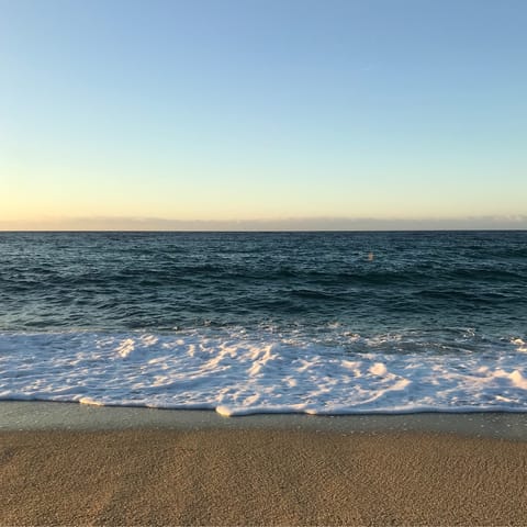 Stroll to Agua Beach, offering fine sands and refreshments for sunbathers