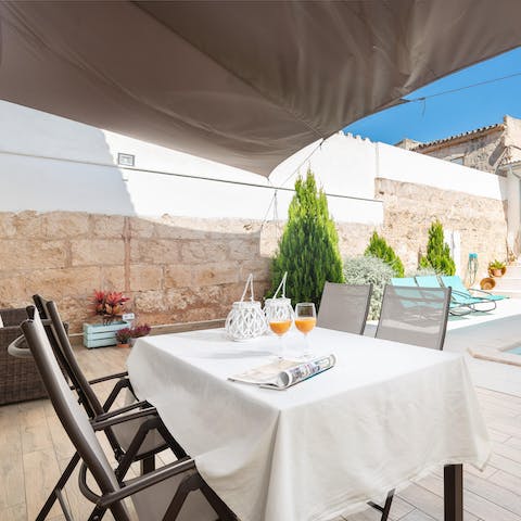 Serve up local Mallorcan delicacies at the poolside alfresco dining area