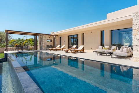 Swim laps in the sun-warmed pool on a clear Sicilian day