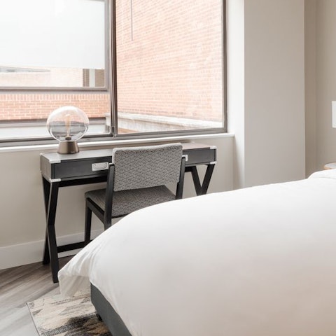 Catch up on work at the bedroom's desk space