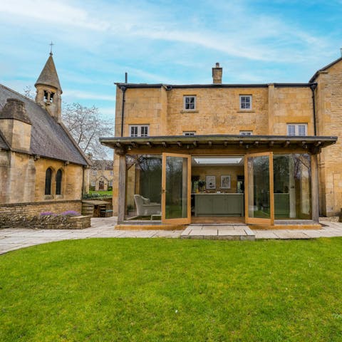 Take in the views over Broad Campden's church from the garden