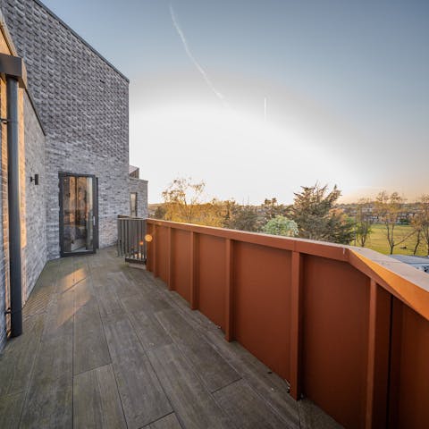 Enjoy an evening drink from the balcony as the sun goes down