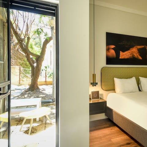 Open up the bedroom's French door and let the Tel Aviv sunshine in