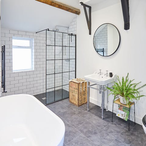 Preen and pamper yourself in the chic bathroom