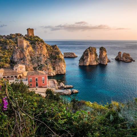 Make the short drive into Scopello village and swim in the sea