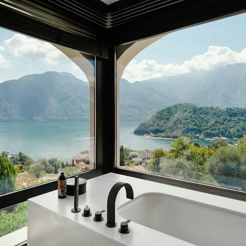 Relax in the bath with its vistas over the tranquil water and sky