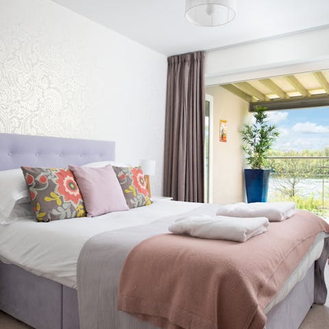 Wake up to serene views of the lake outside your window