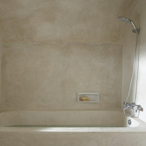 Treat yourself to a long soak in the honey-coloured bathroom