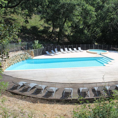 Relax on a lounger by the shared swimming pool