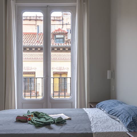 Wake up to beautiful rooftop views from the peaceful main bedroom